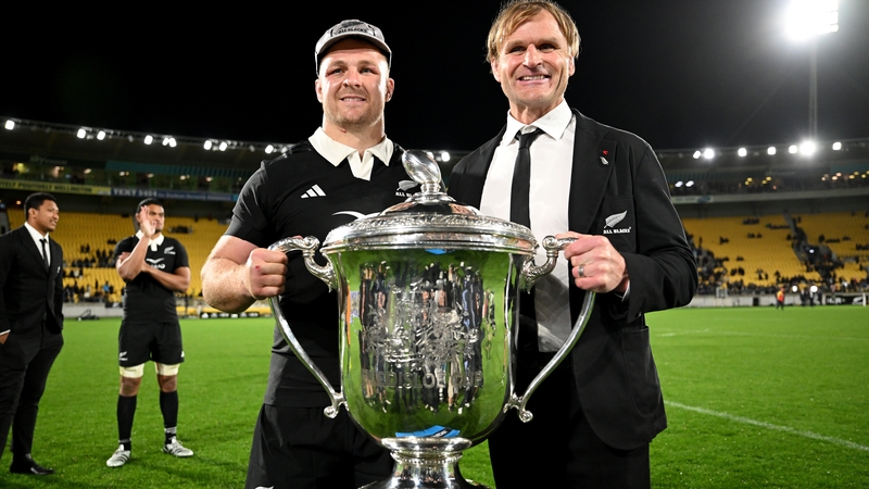 New Zealand flanker Sam Cane (L), who earned his 100th cap, and head coach Scott Robertson with the Bledisloe Cup