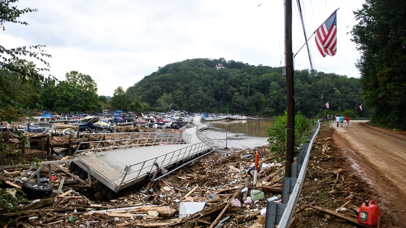 The Rocky Broad River flows into Lake Lure and overflows the town with debris from Chimney Rock, North Carolina due to rains from Storm Helene