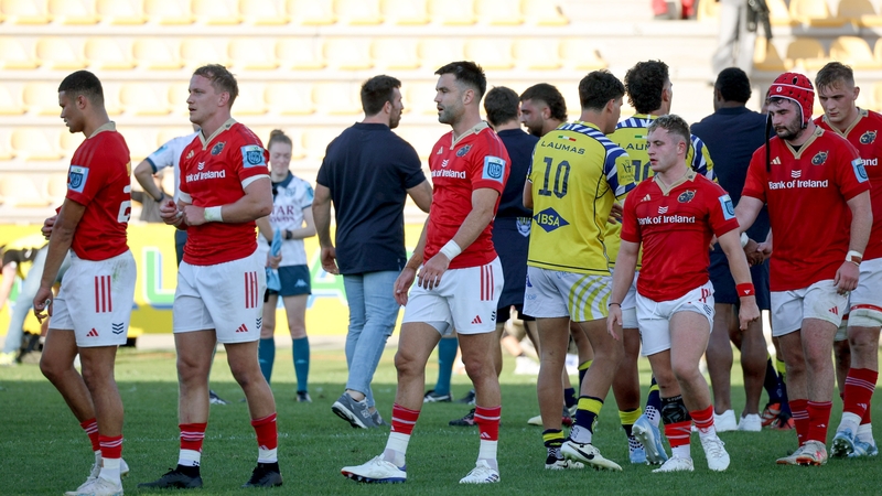 Munster players following the defeat in Parma