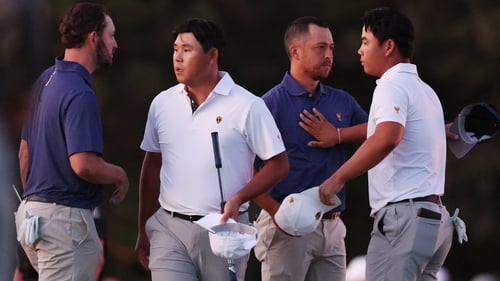 Patrick Cantlay and Xander Schauffele beat Si Woo Kim and Tom Kim on the final hole in near darkness