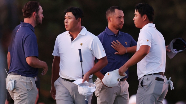 Patrick Cantlay and Xander Schauffele beat Si Woo Kim and Tom Kim on the final hole in near darkness