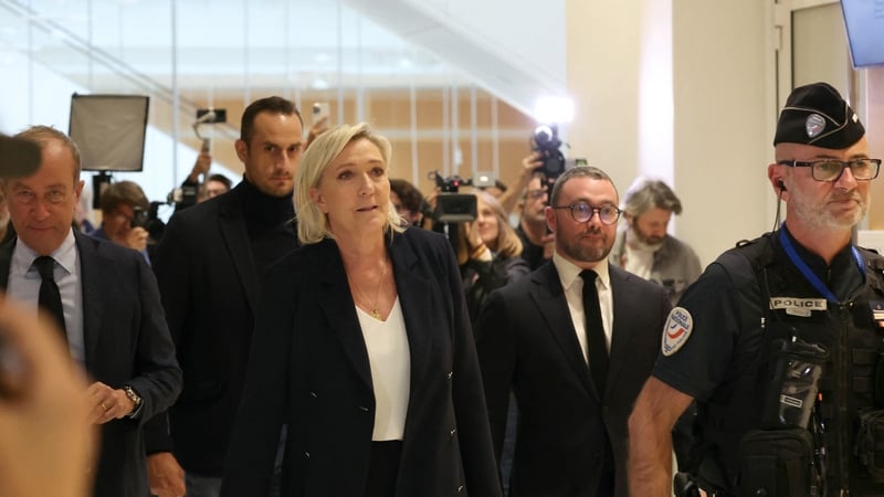 Marine Le Pen pictured leaving court in Paris where she is on trial along with 24 other people accused of misusing EU funds