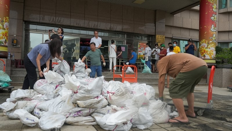 Sand bags are being distributed from city government district offices in Kaohsiung ahead of Super Typhoon Krathon