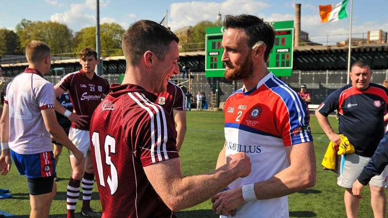 Ronan McGinley (R) greets Danny Cummins after New York's clash with Galway in 2015