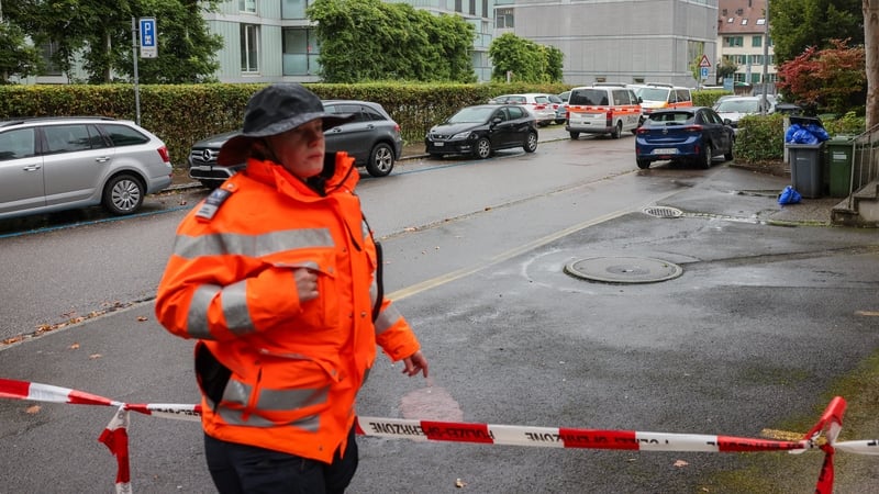 Police officers in Zurich, Switzerland, cordon off the area where a man attacked several children injuring three, before being arrested