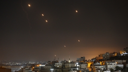 Many rockets, fired from Iran towards Israel, are seen over Jerusalem from Hebron, West Bank