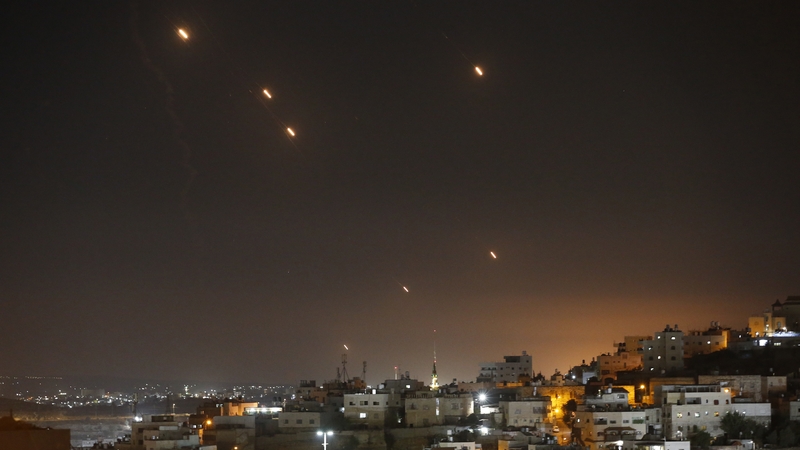 Many rockets, fired from Iran towards Israel, are seen over Jerusalem from Hebron, West Bank