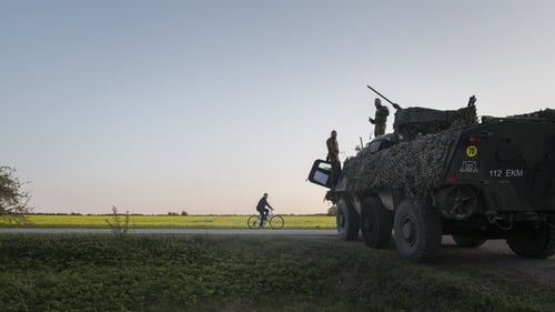 Estonian soldiers chatting with a local during a training exercise last year in Kadrina, northern Estonia