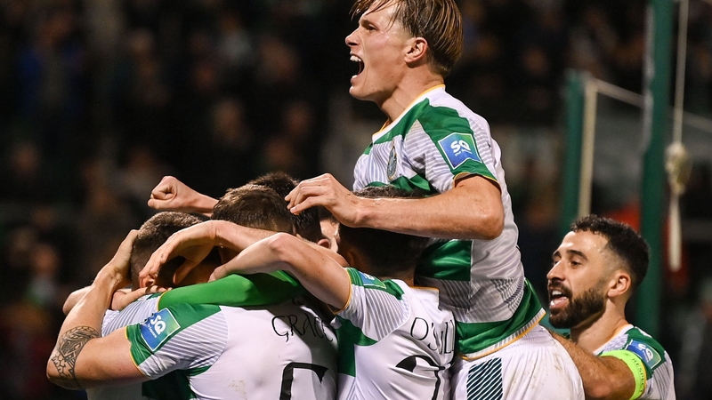 Shamrock Rovers players mob Dylan Watts after his goalscoring heroics