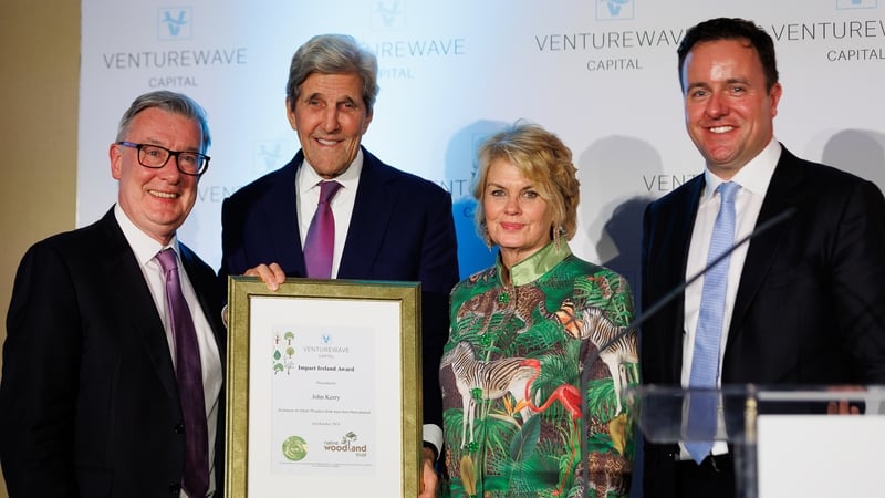 Kieran McLoughlin, award winner John Kerry, Anne Finucane and Alan Foy at the Impact Ireland convention