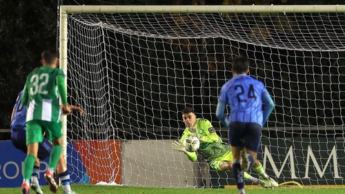 Jimmy Corcoran gets down to save Hugh Parker's penalty