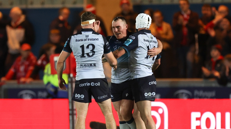 Peter Dooley of Connacht, centre, celebrates with team-mates Cathal Forde and Mack Hansen after the narrow victory in Wales