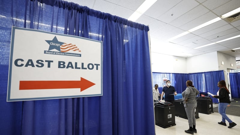 Voters cast their ballots in early voting in the 2024 presidential election at the Board of Elections Loop Super Site in Chicago, Illinois
