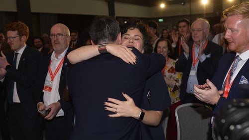 Colum Eastwood and Claire Hanna embrace during the SDLP annual conference