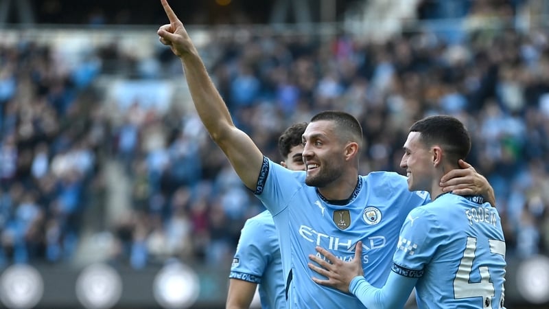 Mateo Kovacic (L) celebrates his second goal against Fulham