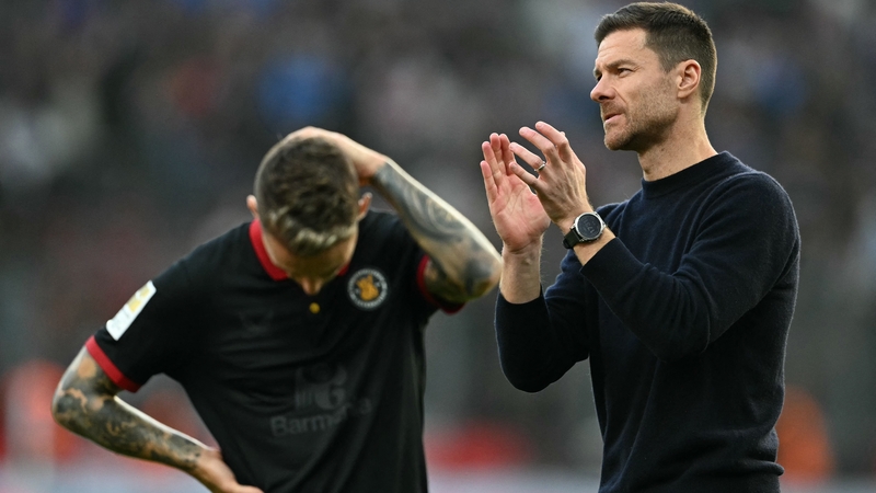 Grim-aldo: The Leverkusen defender (L) and manager Xabi Alonso react at full-time