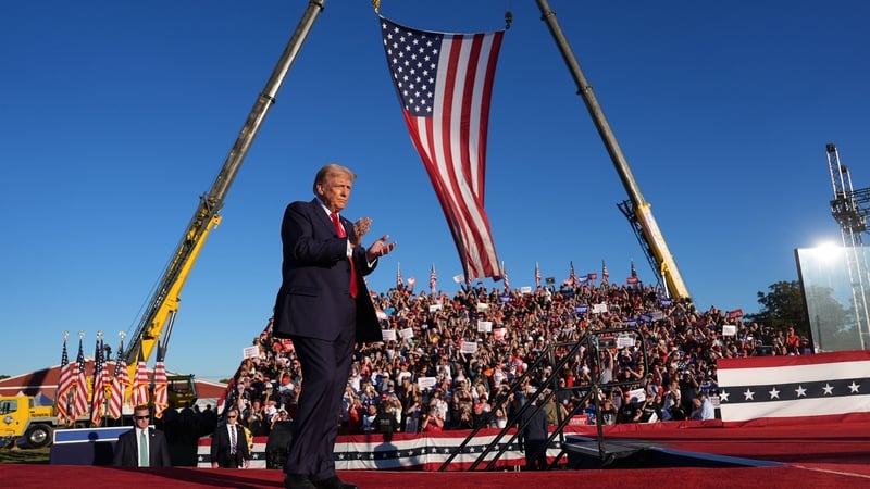 Republican presidential nominee and former president Donald Trump as he arrives to speak at a campaign event at the Butler Farm Show