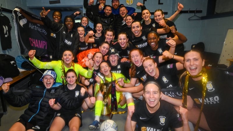 Athlone Town players celebrate in the dressing room with the trophy after defeating Bohemians to win the SSE Airtricity Women's Premier Division