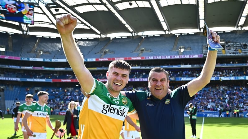 Brian Duignan celebrates with his father and county board chairman Michael Duignan after the Joe McDonagh victory