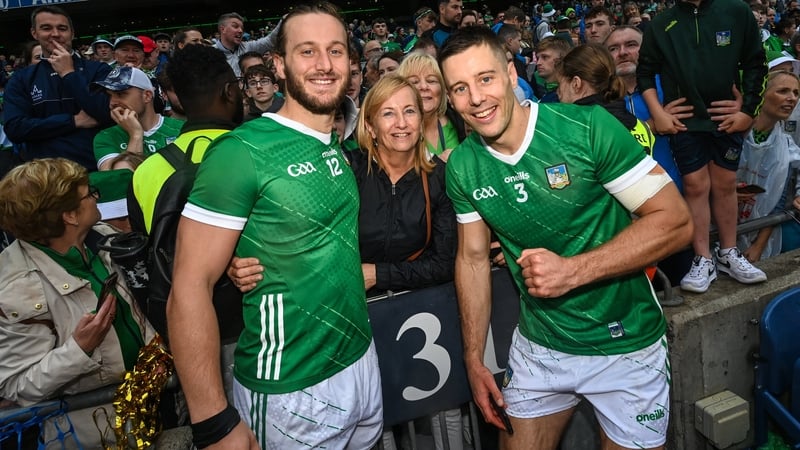 Tom Morrissey (L) and Dan Morrissey with their mother Mairead after Limerick's All-Ireland final victory in 2023