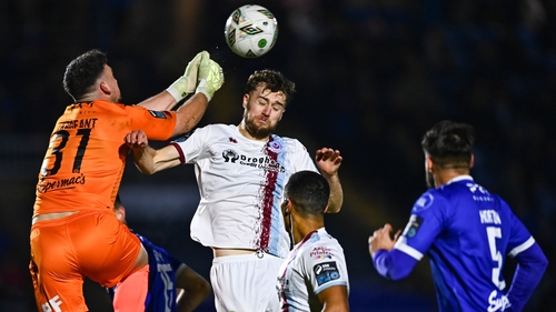 Waterford goalkeeper Sam Sargeant punches a cross away