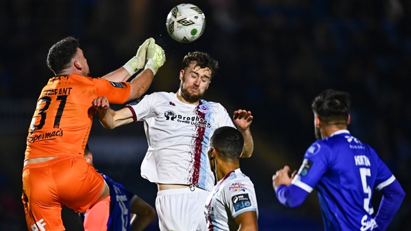 Waterford goalkeeper Sam Sargeant punches a cross away