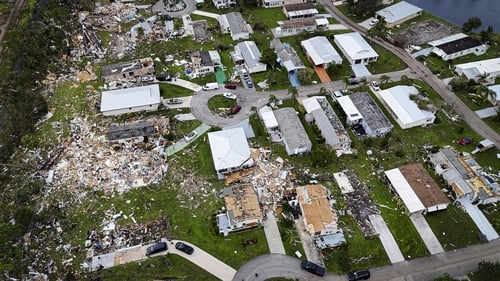 More than two million households and businesses were still without power and some areas remained flooded