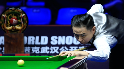 Xiao Guodong plays a shot in the all-Chinese final match against Si Jiahui