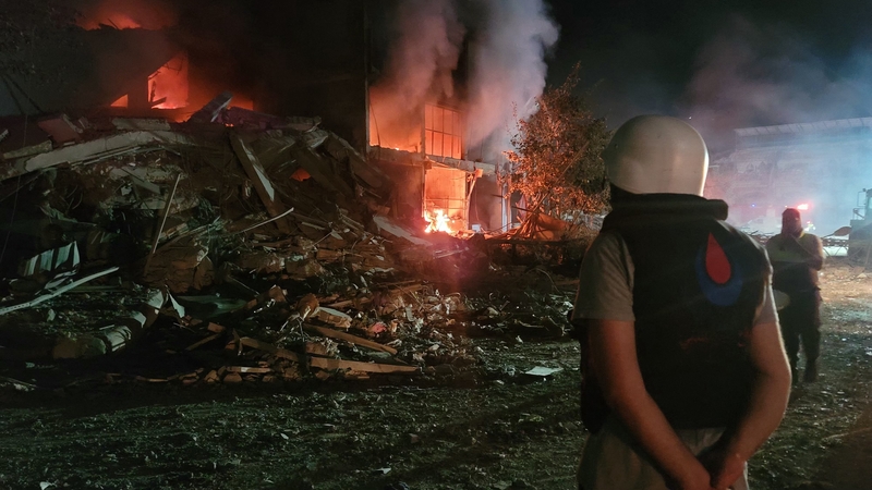 Fires burn and damage is seen at the site of an Israeli airstrike that targeted the southern Lebanese city of Nabatiyeh