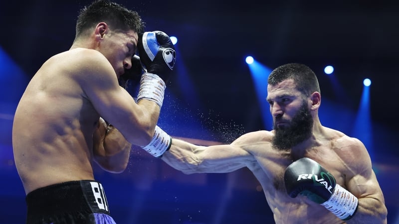Artur Beterbiev (R) outpointed Dmitrii Bivol to add the WBA beltsto his IBF, IBO, WBC titles