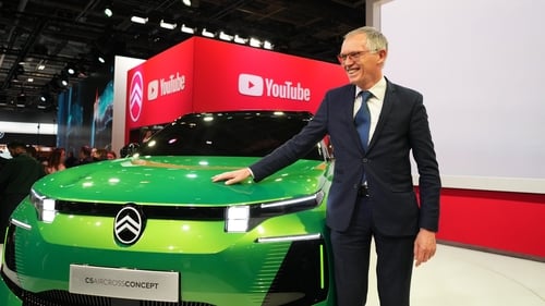 Carlos Tavares, CEO of Stellantis, beside a Citroen C5 Aircross Concept car at the Paris Motor Show