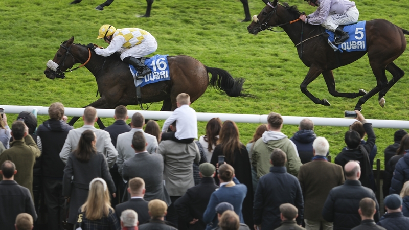 Jamie Powell riding Alphonse Le Grande (L) to victory in the Club Godolphin Cesarewitch Handicap