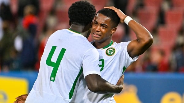 James Abankwah (L) and Aidomo Emakhu console each other after the Republic of Ireland's draw against Italy
