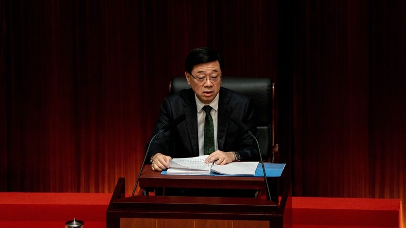 Hong Kong chief executive John Lee reads his 2024 policy address