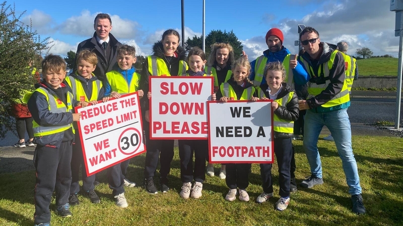 Primary school students at Culleen National School took part in a day of action to highlight the lack of a footpath and the high speeds outside the school