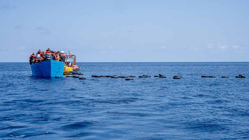 Migrants on a wooden boat in the Mediterranean Sea earlier this year