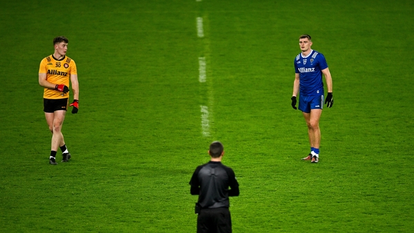 Ulster's Odhran Murdock (L) and Munster's Diarmuid O'Connor prepare for the new throw-in