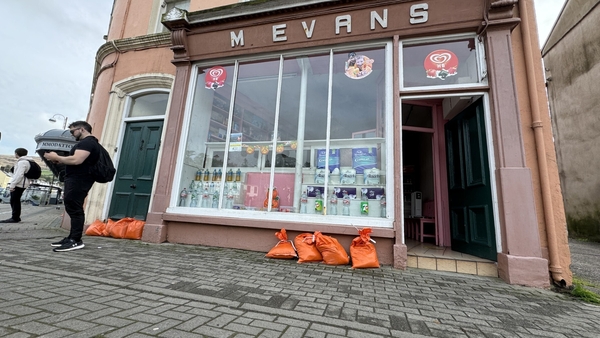 Sandbags are lined up outside several premises across the town
