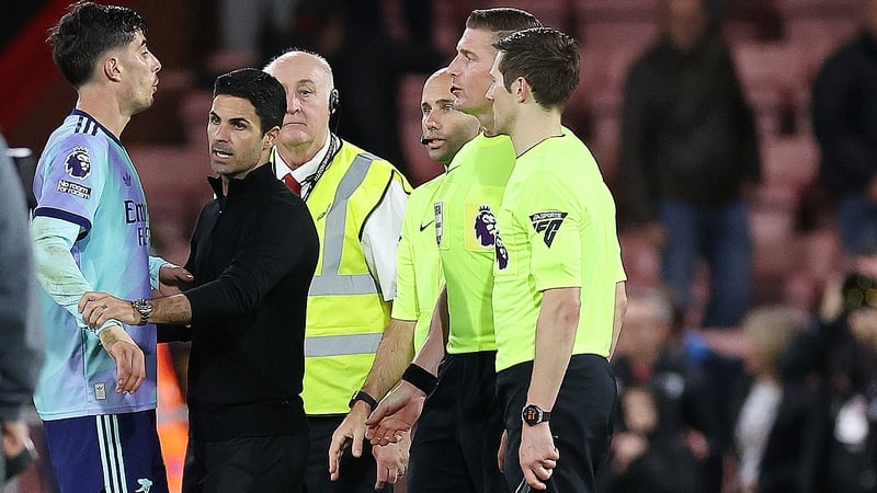 Arsenal manager Mikel Arteta attempts to prevent Kai Havertz from speaking to the match officials