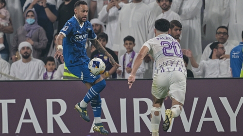 Neymar (L) on the ball against Matias Palacios of Al-Ain