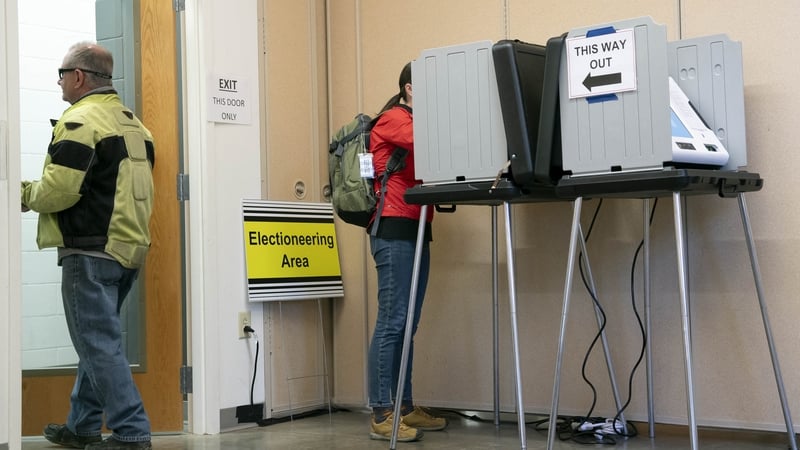 People cast early votes at a polling station in Asheville, North Carolina
