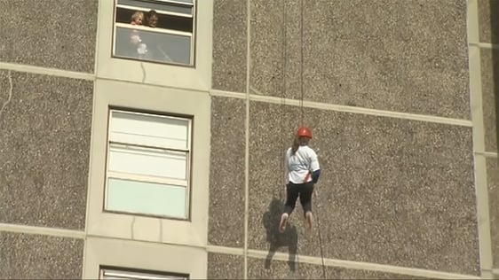 A student abseils down Joseph Plunkett Tower in Ballymun for charity in 2009.