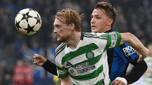 Liam Scales (L) in action against Mateo Retegui of Atalanta