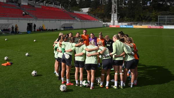Players huddle around Eileen Gleeson during training at Mikheil Meskhi Stadium II in Tbilisi