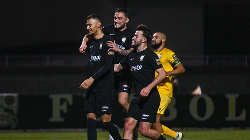 Dean Ebbe (L) celebrates netting the winner