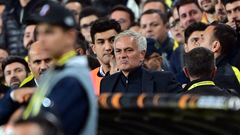 An irked Jose Mourinho looks on from the stands after his red card