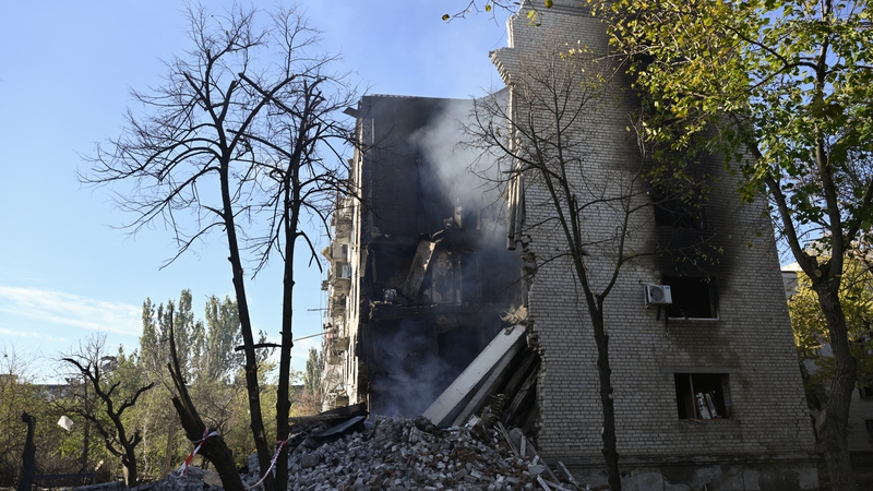 Smoke rises from a residential building which was damaged in a Russian strike on Lyman, Donetsk region, on 24 October