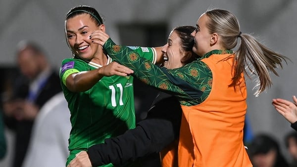 Katie McCabe (L) celebrates her second goal