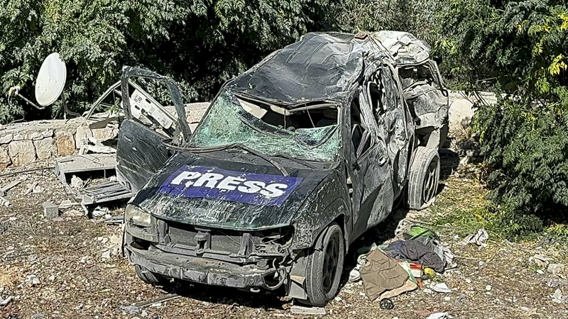 A car marked "Press" at the site of an Israeli airstrike that targeted where a number of journalists were located in the southern Lebanon