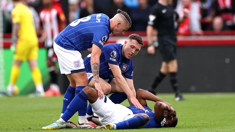 Kalvin Phillips and Dara O'Shea of Ipswich Town check on Ogbene